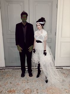 two people dressed up in halloween costumes standing next to each other