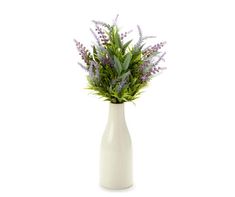 a white vase with purple flowers in it