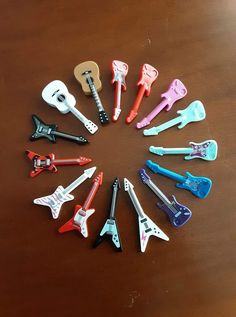 there are many different kinds of toy guitars in the shape of a starburst