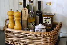 a wicker basket filled with bottles and condiments