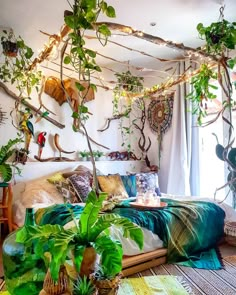 a bed room with plants on the wall and an instagram post about bohemian bedroom decor