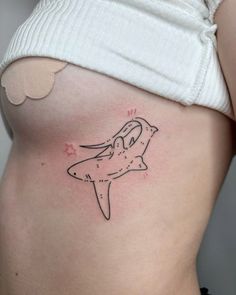 a woman's stomach with a starfish tattoo on it