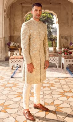 Buy Embroidered Pakistani Groom Sherwani Dress for Wedding that comes in premium quality fabric. The Sherwani Dress is available Online. Fast shipping. Wedding Outfit Men Unique, Sherwani Shoes, Mens Sherwani Wedding, Golden Sherwani, Sherwani Groom Wedding, Groom Indian Wedding Outfits, Engagement Dress For Groom, Sherwani For Wedding, Men Wedding Dress