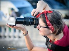 a woman taking a photo with her camera