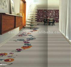 the hallway is decorated with colorful circles and flowers on the floor, along with an area rug