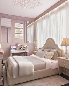 a bedroom with pink walls and white furniture