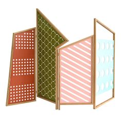 three panels with different patterns on them, one is pink and the other is green