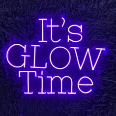 it's glow time neon sign in the dark with purple fur textured background