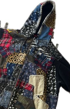 a jacket made out of old clothes with patches and leopards on the front,