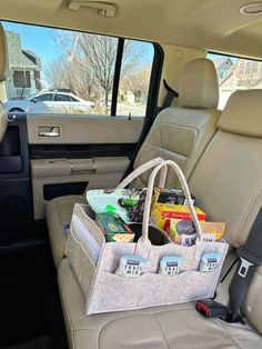 the back seat of a car filled with food and drinks