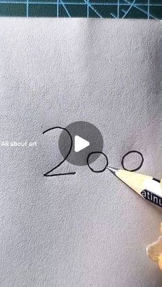 someone is drawing the numbers on a piece of paper with a marker and pencils