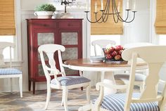 a dining room table with chairs and a chandelier