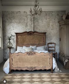 an old fashioned bed with wicker headboard and foot board in a rustic bedroom