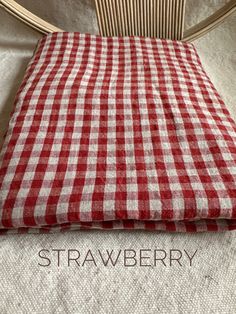 a red and white checkered fabric on a chair