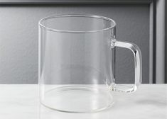 a clear glass mug sitting on top of a counter