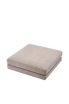 a cushion that is sitting on top of a white surface with no one around it