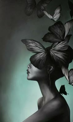 a painting of a woman with butterflies flying around her head and the image is black and white