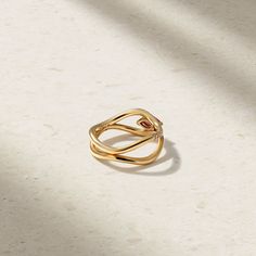 Sculptural and fluid, this ring boasts femininity as it features gently curved shapes that resemble a rippling wave. It showcases a pair of slim silhouette bands, one that is encrusted with an ensemble of twinkling petite diamonds and other with a sleek, high luster finish. A vivid marquise shape ruby rests within the set of mirroring waves to complete the design. Wear yours solo or stack it together with the single wave version of the ring. Metal: 18kt Gold Ruby Weight: 0.50 ct. Diamond Weight: Ruby And Diamond Ring, Red Spinel, Rubellite Tourmaline, Red Gemstones, Ring Metal, Ring Ideas, Pure Color, Women Rings, Natural Gemstones