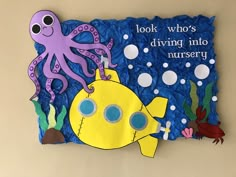 a bulletin board with an octopus and fish on it