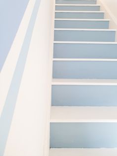 the stairs are painted blue and white