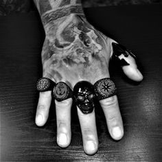 Introducing our Black Heavy Grin Skull Ring, a bold and striking piece of jewelry crafted from high-quality stainless steel. This stunning ring features a highly detailed and intricately designed skull motif, perfect for those who love edgy and alternative fashion. Our Grin Skull Ring is the ideal accessory for anyone looking to make a statement with their style. With its durable construction and high-quality materials, this ring is built to last, ensuring that you can wear it for years to come. Symbolic Black Metal Skull Ring, Black Metal Skull Ring Symbolic Style, Black Skull Print Ring, Gothic Black Rings With Skull Print, Black Skull Rings As Gift, Punk Style Black Skull Ring Gift, Black Skull Rings For Gift, Black Metal Skull Ring As Gift, Black Metal Skull Ring Gift