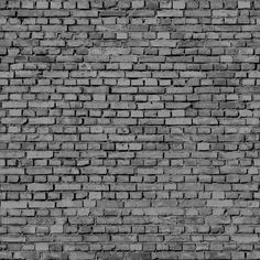 a black and white photo of a brick wall