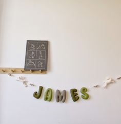 the word james spelled with magnets on a white wall