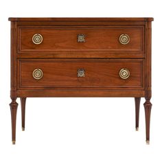 an antique chest of drawers with brass pulls and knobs on the front, against a white background