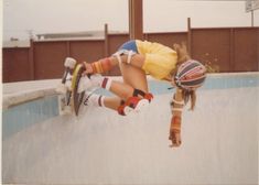 a person on a skateboard doing a trick in the air at a skate park