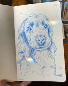 a drawing of a dog is shown in the open book, which shows it's face