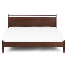 a bed with white sheets and wooden headboard on it's side, in front of a white background