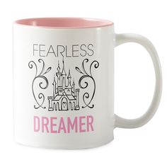 a white and pink coffee mug with a castle on it that says fearless, i am a