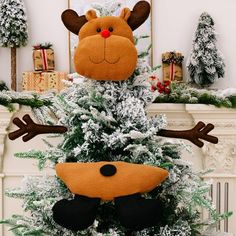 a christmas tree decorated with reindeer head and antlers