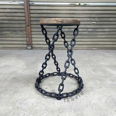 a metal table with chains attached to it