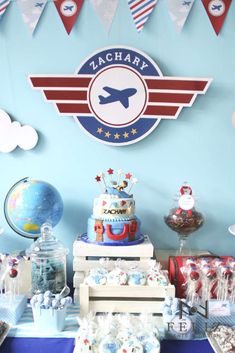 an airplane themed birthday party with cake and decorations