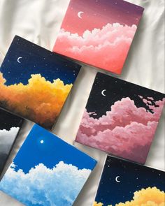 four paintings of clouds and the moon are painted on canvases with acrylic paint