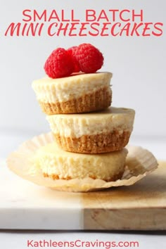 small batch mini cheesecakes stacked on top of each other with raspberries