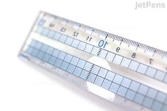 a close up of a ruler on a white surface