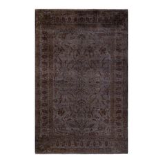 a rug with an intricate design on the front and back side, in dark brown tones