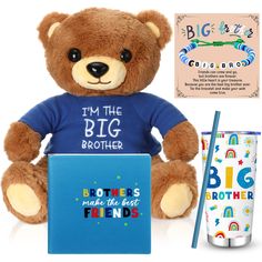 a brown teddy bear sitting next to a blue book and cup with the words i'm the big brother on it