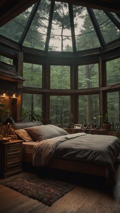 a large bed sitting in a bedroom next to a window filled with lots of windows