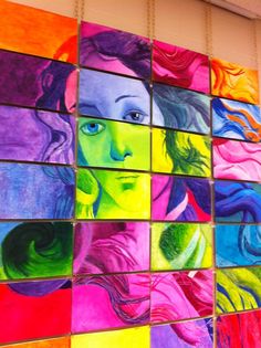 colorful paintings are displayed on the wall in this school's cafeteria room, which is decorated with glass tiles