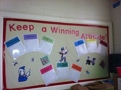 a bulletin board that says keep a winning attitude