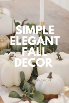 white pumpkins and greenery on a table with the words simple elegant fall decor