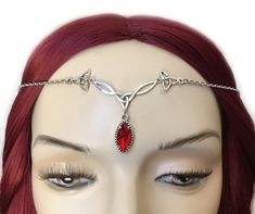 "This is a new handmade headpiece. It is made with antiqued silver plated Celtic knots, accented with a high quality BRIGHT RUBY RED glass jewel that sparkles like crystal. Centerpiece is worn with silver plated cable chain. Decorated portion is 2 1/2\" wide and 1 1/4\" tall in the center. Headpiece is adjustable 21-24\" with a lobster clasp and chain extender in the back. If you would like a different length, please send us a message. Matching necklace and earrings are available in our store in Circlet Crown, Silver Headpiece, Tiara Headband, Silver Head Piece, Rainbow Topaz, Celtic Goddess, Onyx Crystal, Crown Tiara, Celtic Knots