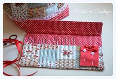 two pieces of fabric with red and white polka dots on them next to some scissors