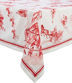 a red and white christmas tablecloth with santa's sleigh