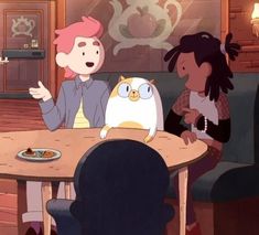 two people sitting at a table with an owl in front of them and one person pointing