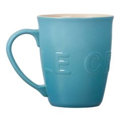 a blue coffee cup with the word c e on it