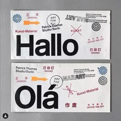 two stickers that say hello and hello to each other on a gray surface with an orange arrow in the middle